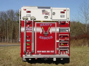 Rear view showing heavy rescue rear door graphics and warning lights