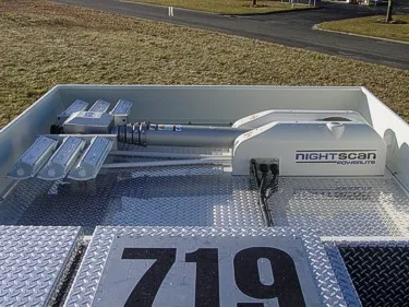 Roof equipment close-up showing NightScan light mast and deck fittings