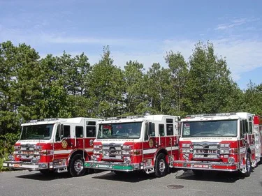 Apparatus lineup front view showing three pumpers parked side by side