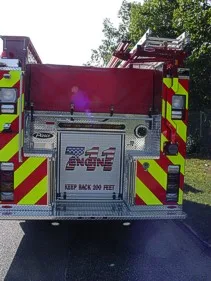 Rear view showing pumper chevrons and open rear center panel