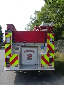 Rear view showing chevrons and raised engine number on roll-up door