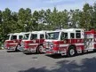 Pumper lineup view showing multiple cabs parked in row