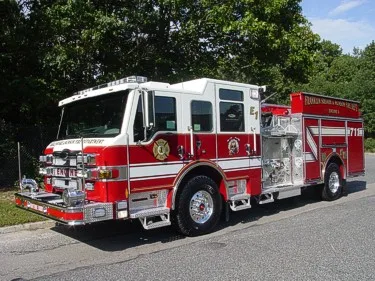 Front-left exterior view showing a single pumper in lineup
