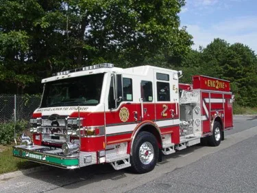 Front-left profile showing pumper cab and side body