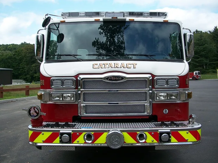 Head-on front view showing grille, windshield, warning lights, and front bumper intake ports.