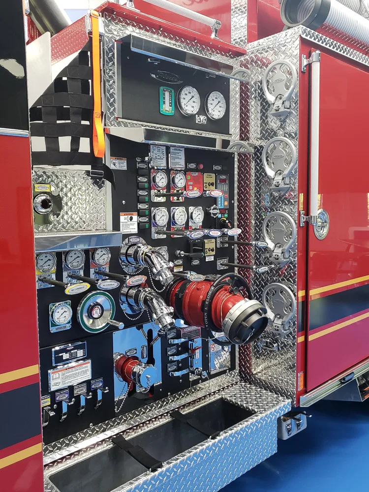 Pump panel close-up showing gauge cluster and valve controls