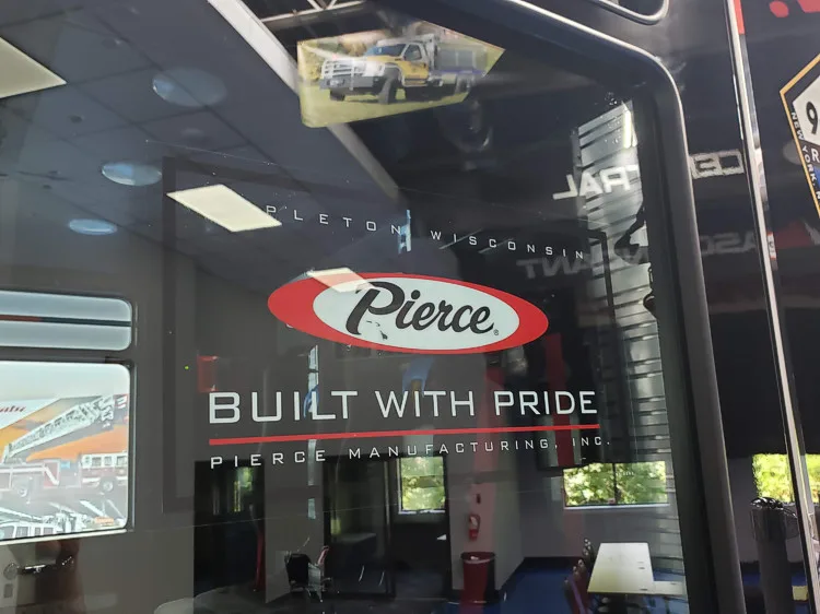 Cab side window close-up showing Pierce decal and reflective glass