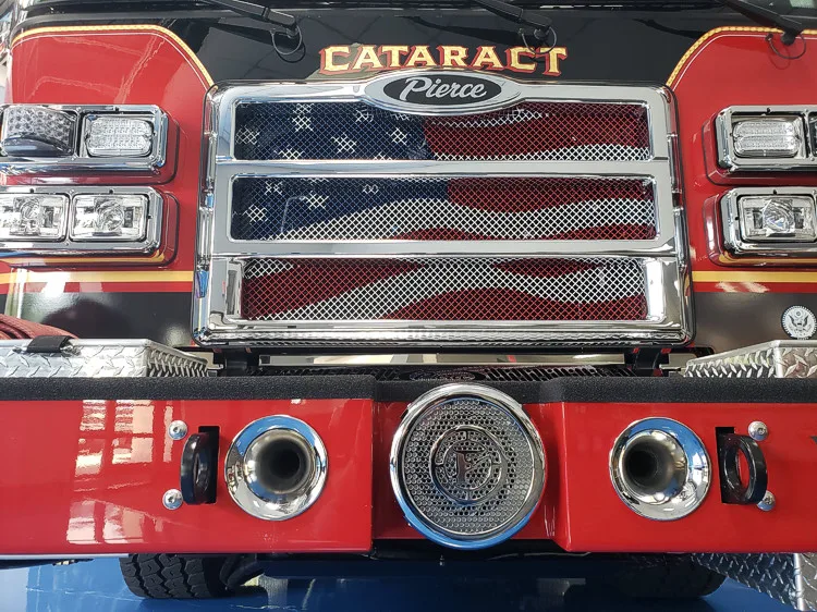 Front grille close-up showing American flag insert and CATARACT lettering