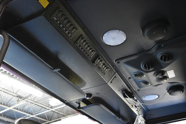 Cab overhead console close-up showing switches and lighting controls