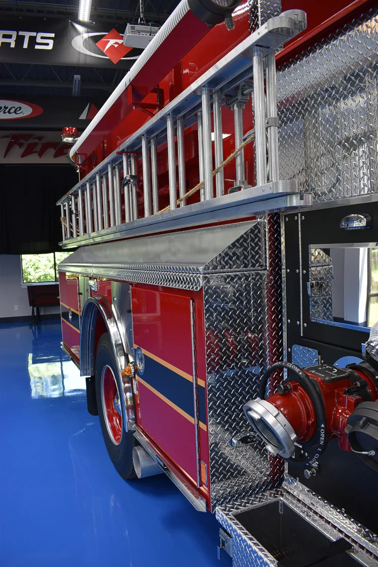 Rear side profile close-up showing side body and wheel area