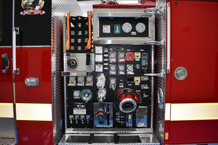 Pump panel close-up showing gauges, valves, and intake controls