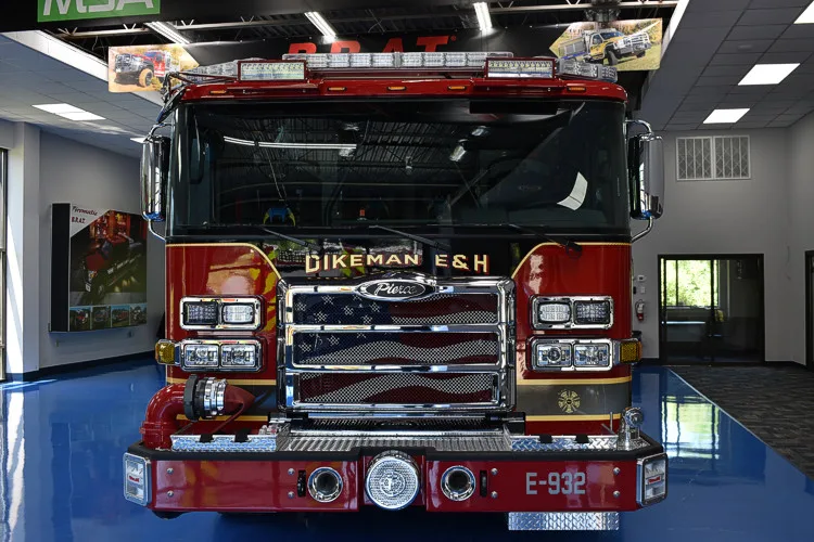 Head-on front view showing grille, bumper, and warning lights