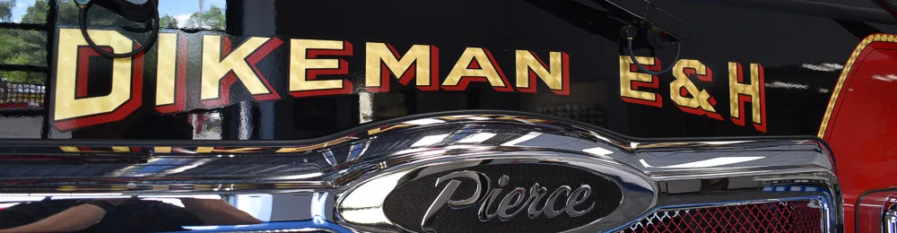 Front grille close-up strip showing company lettering