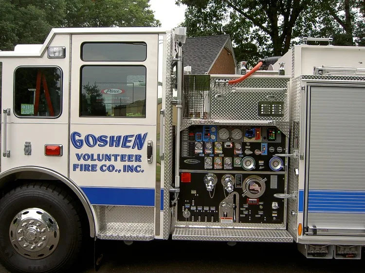 Pump panel close-up showing gauges, valves, and control levers