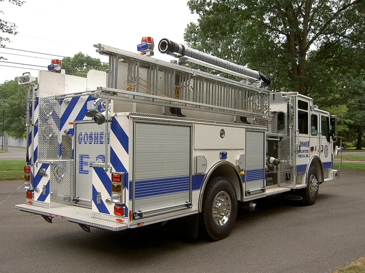 Rear-right exterior view showing ladder rack, rear body, and side compartments