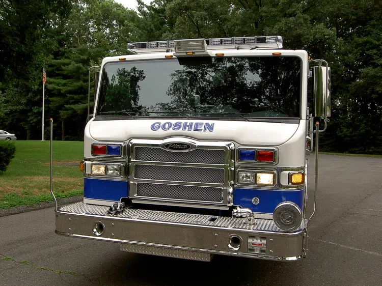 Front exterior view showing grille, bumper, and warning lights