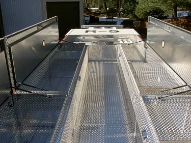 Roof walkway view showing diamond-plate deck and side safety rails