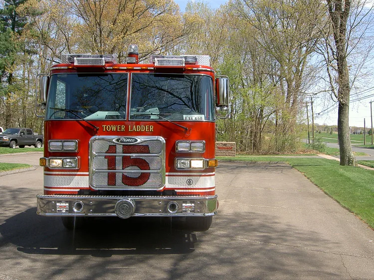 Front exterior view showing grille, bumper, and warning lights