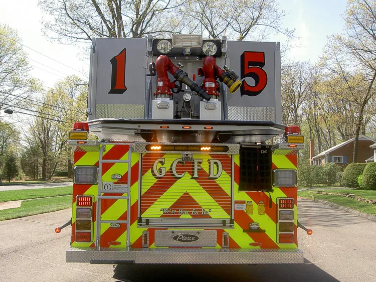 Rear view showing chevrons, bucket base, and rear warning lights