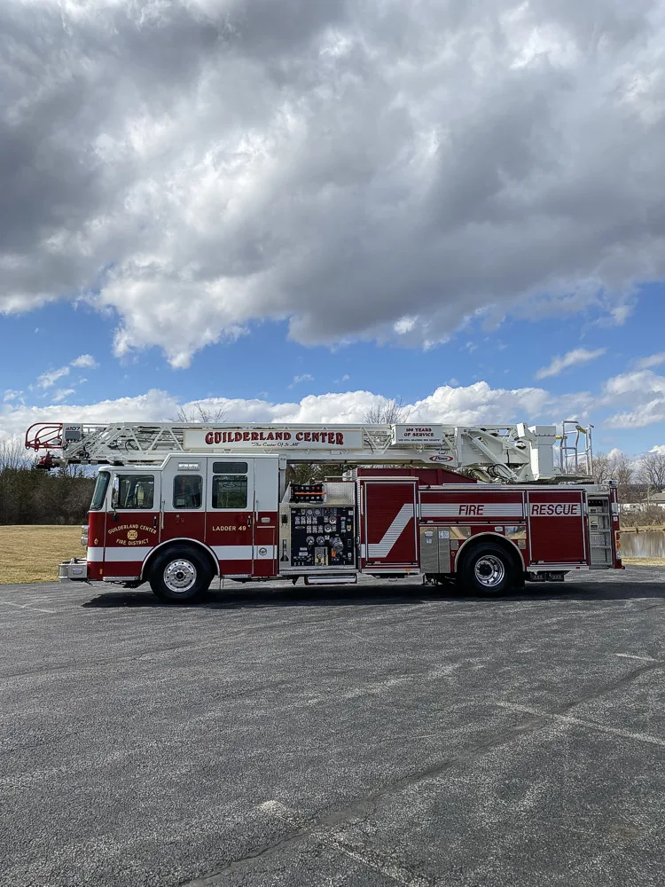 Driver-side wide profile view showing full apparatus length