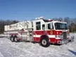 Small front-left exterior thumbnail of tower ladder truck on snow