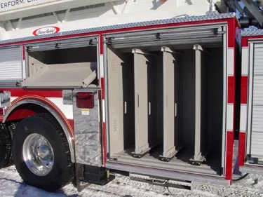 Open side compartment showing vertical ladder and pike pole storage slots