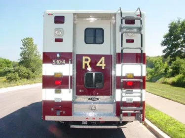 Rear view showing back doors, rear ladder, and warning lights marked R4