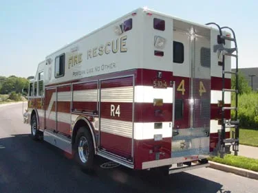 Rear-right exterior view showing long rescue body and rear door section