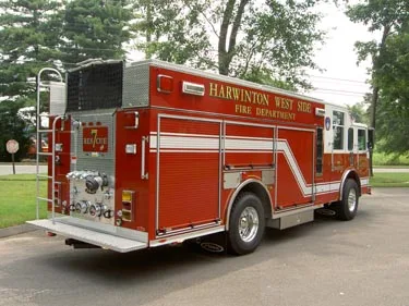 Rear-right three-quarter view showing body compartments and rear wheel