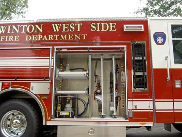 Open side compartment showing bottle mounts, valves, and lower tool storage