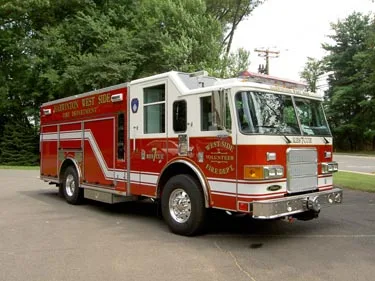 Front-left exterior view showing bumper, cab, and side body compartments