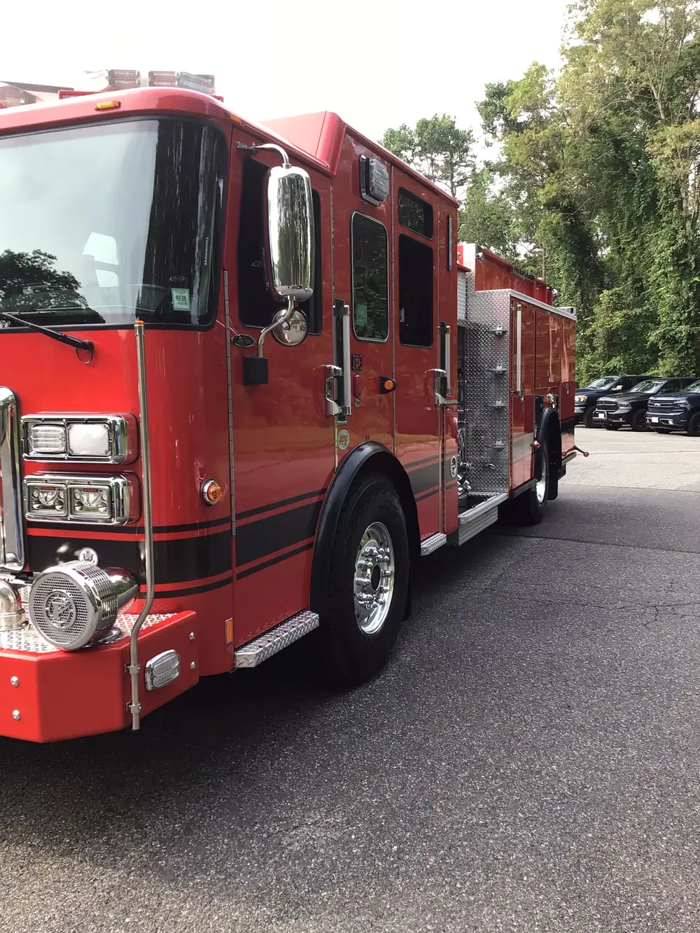 Front-right side view showing crew cab and mid-body compartments