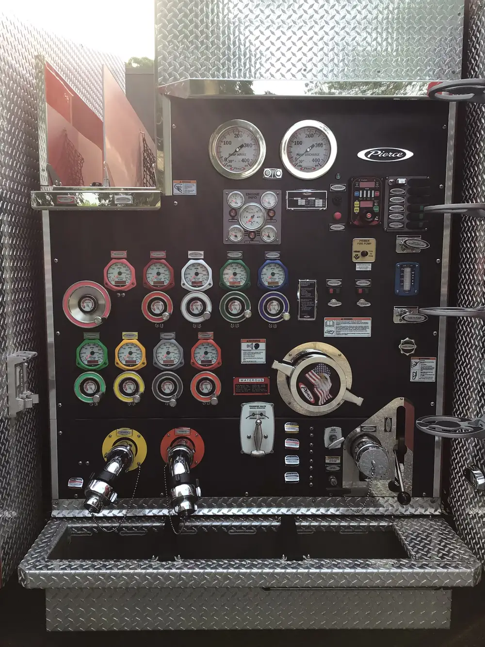 Pump panel close-up showing gauges, valves, and intake controls