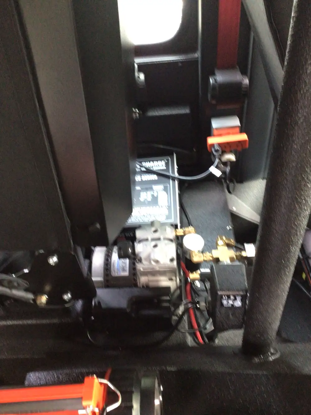 Under-console mechanical assembly close-up with wiring and mounted components