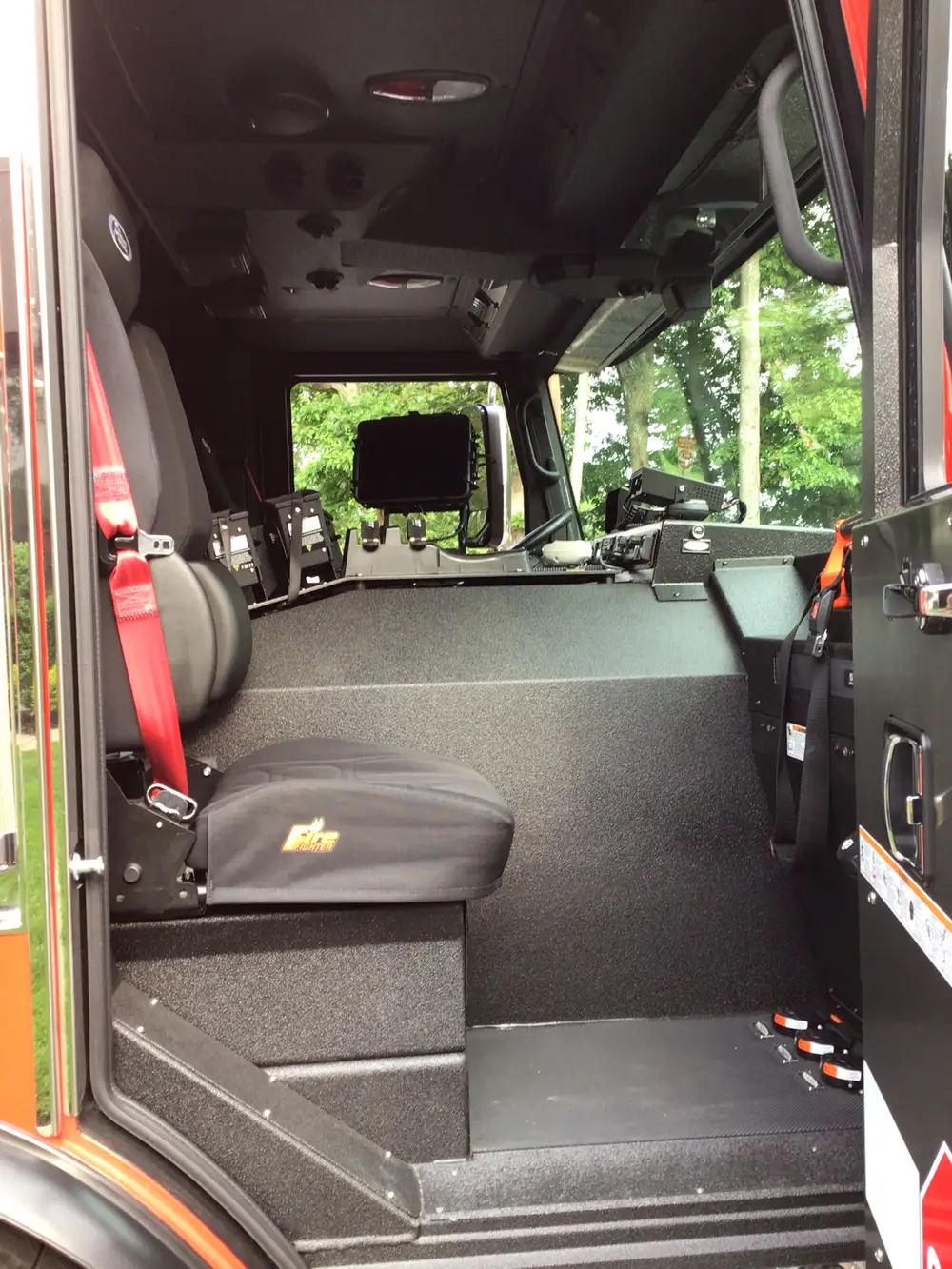 Cab side-entry view showing front seats and center console area