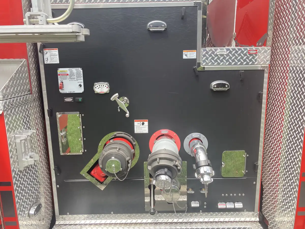 Rear intake panel close-up with large suction connections and control levers