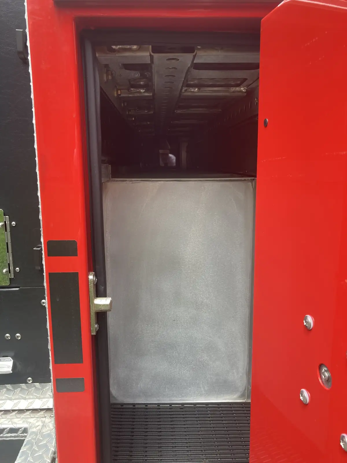 Vertical storage channel close-up beside rear intake panel