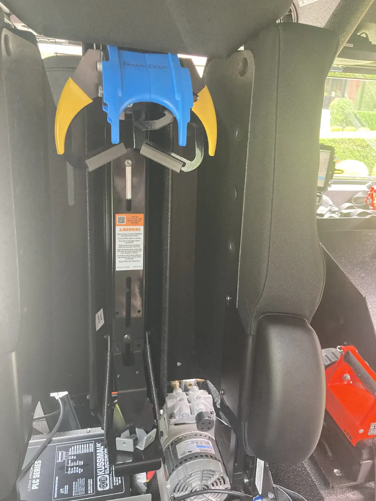 Center console view with tablet mount, radio docks, and cup holders