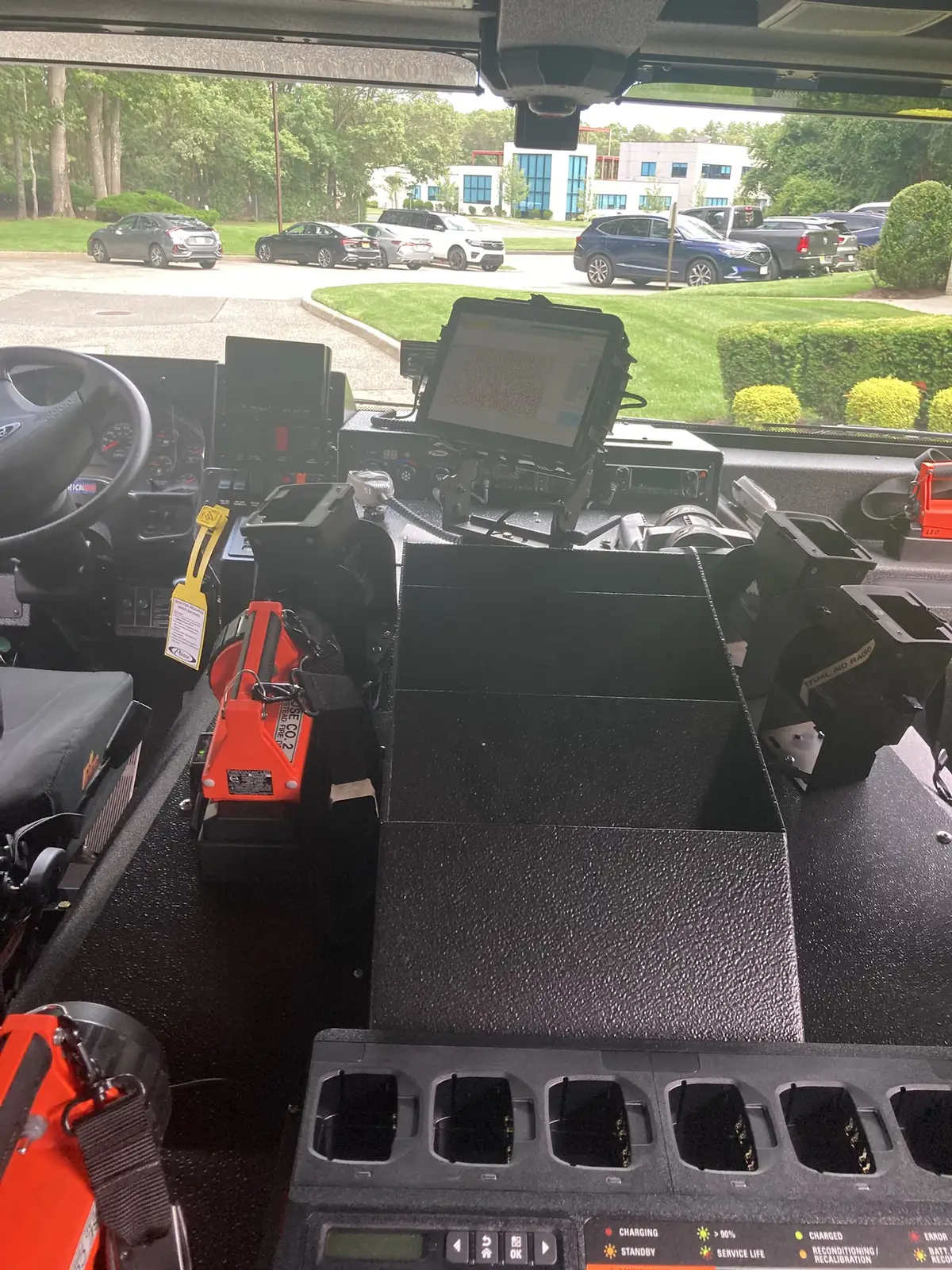 Center console close-up showing tablet screen and charging cradle