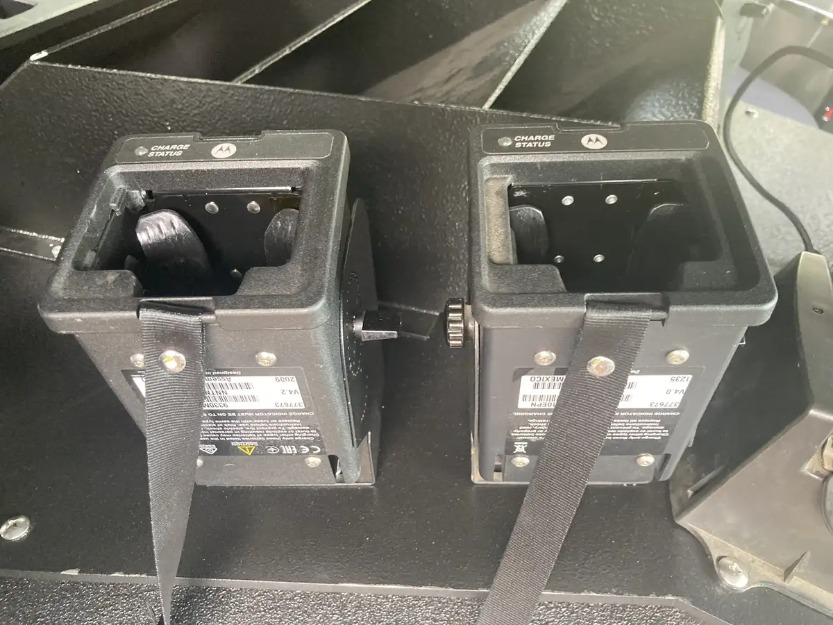 Front bumper intake elbow close-up with chrome coupling