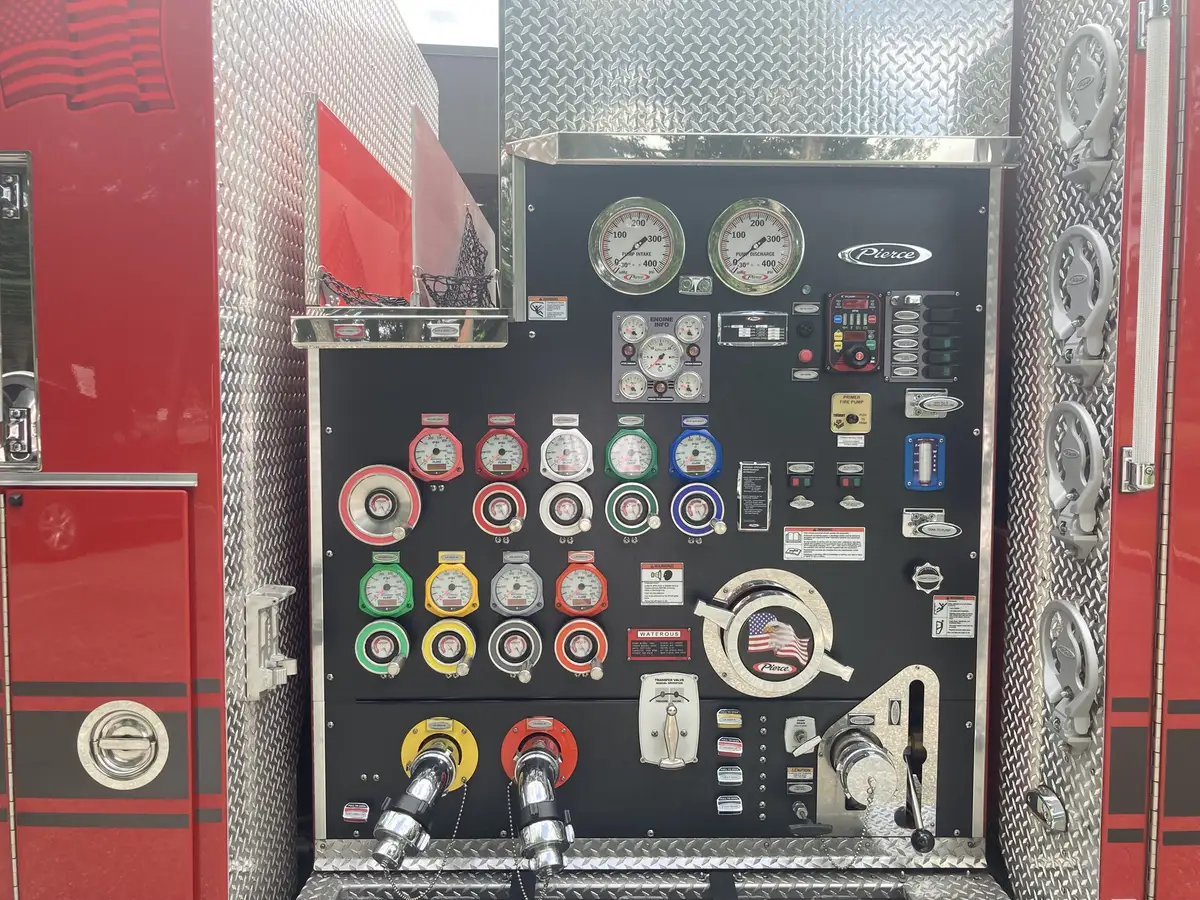 Open side toolboard compartment with fittings, gauges, and mounted tools