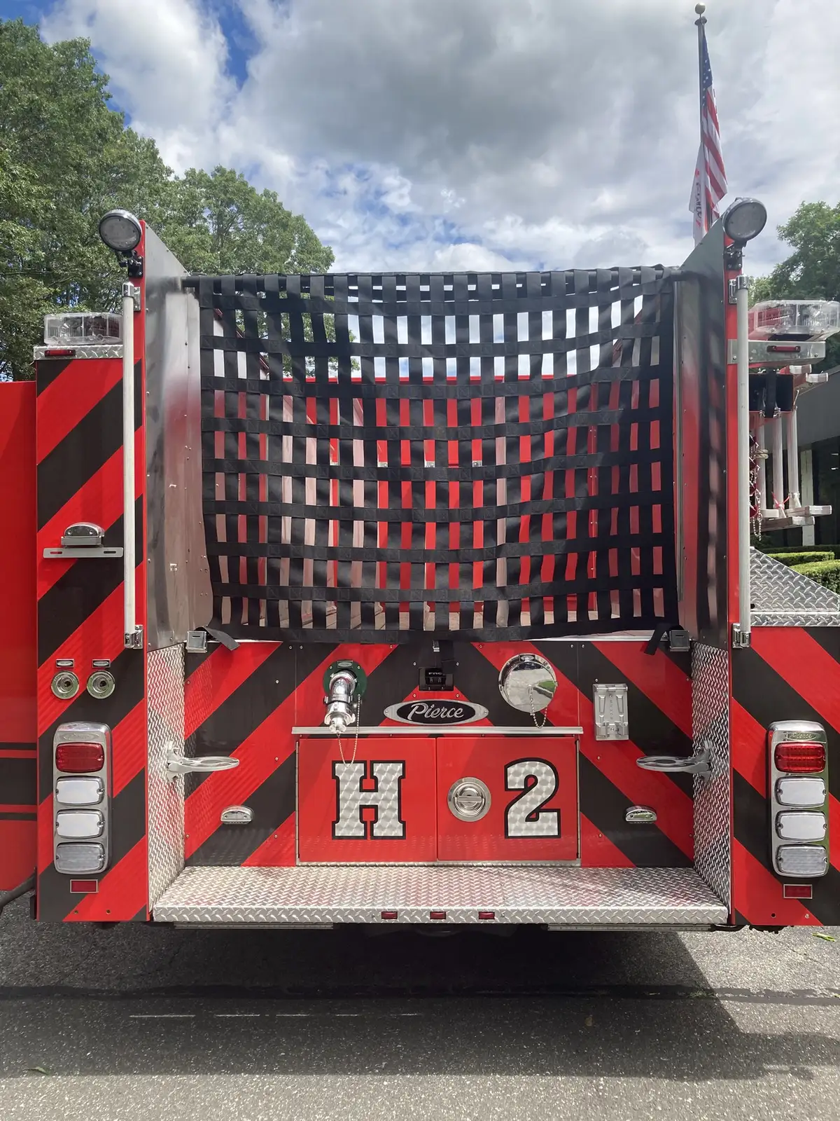 Door logo close-up with company 2 crest and crossed tool symbols
