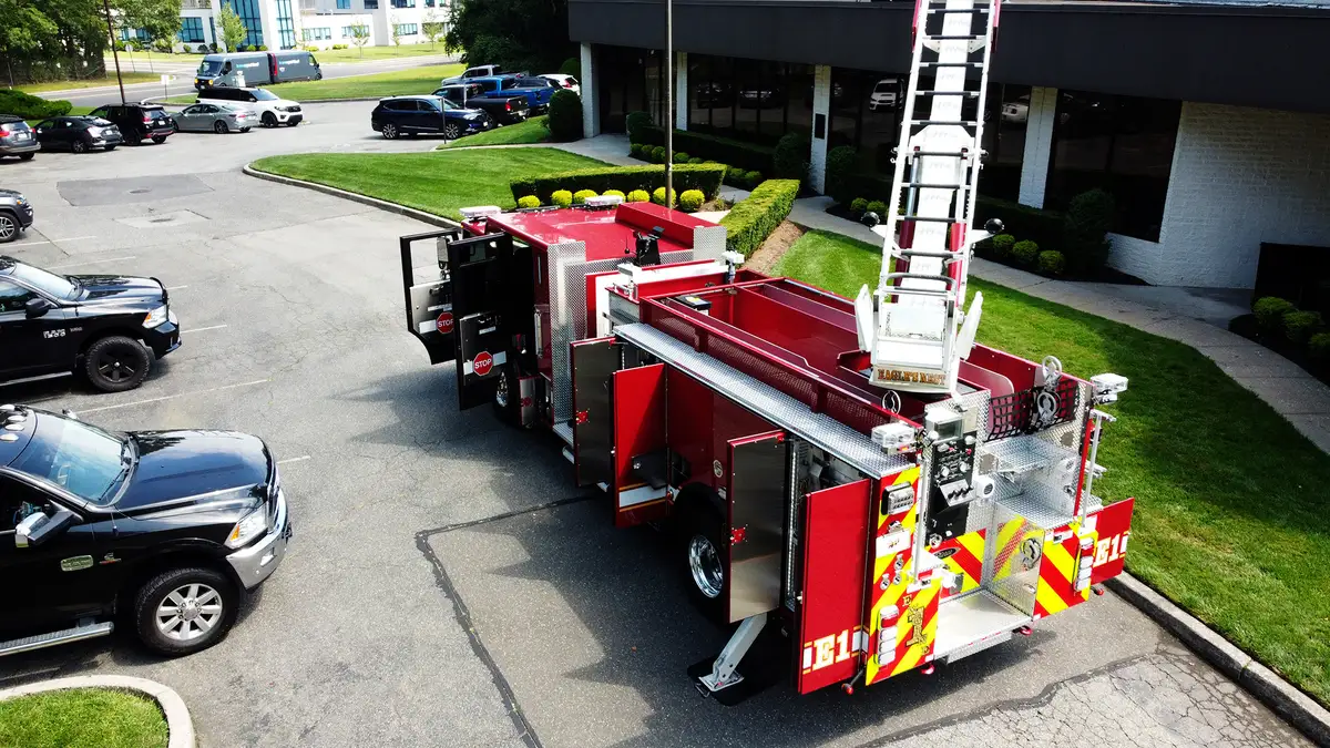 Rear-right exterior view showing chevrons, lower rear panel, and side body