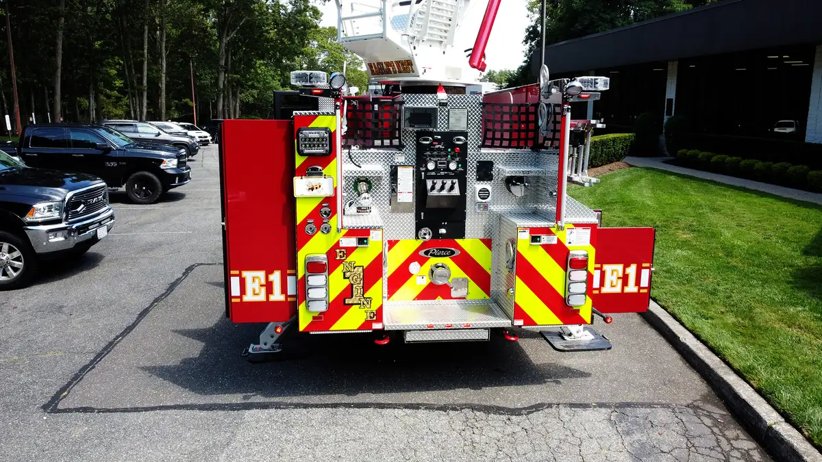 Front-right low-angle view showing bumper, grille, and cab corner lights