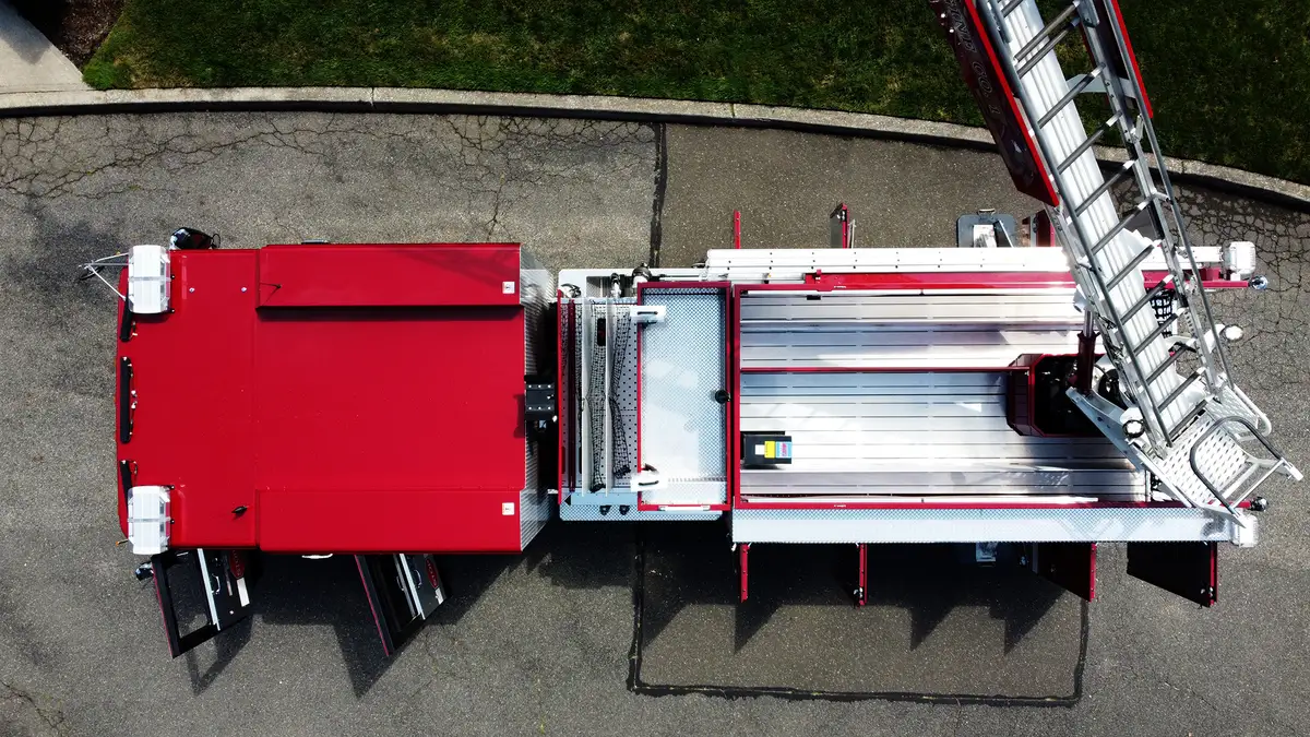 Open side compartment view showing slide-out trays and mounted tool storage