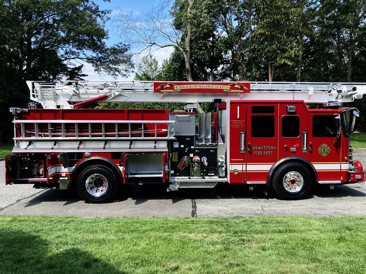 Open side compartment close-up showing rescue tool mounts and shelf dividers