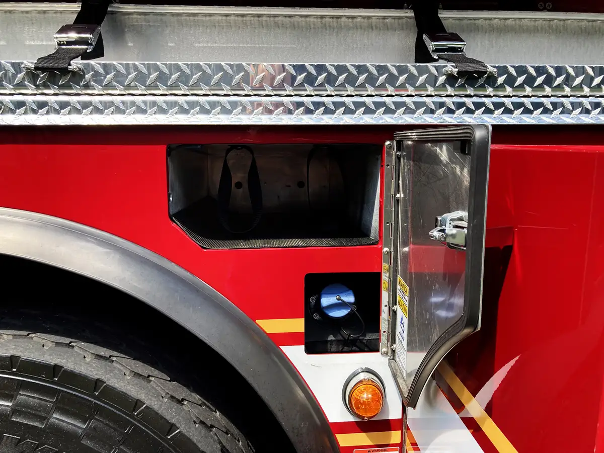 Open lower compartment view showing pull-out tray and wheel area