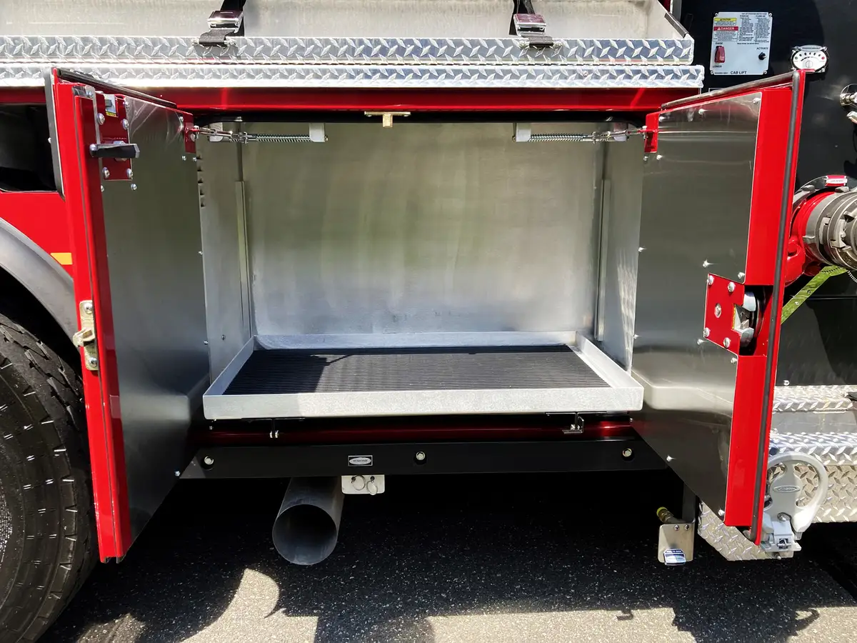 Pump operator area view showing side control panel and adjacent compartments