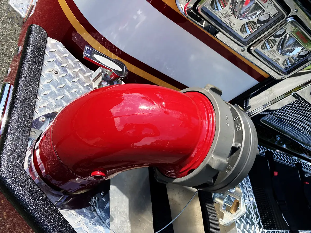 Rear hosebed view showing hose stacks and hosebed rails above chevrons