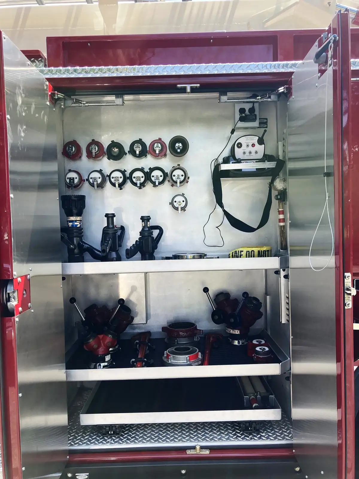 Center console close-up showing radio controls, switches, and cup holders